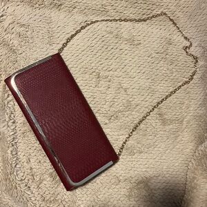 Also Burgundy Clutch or Purse. Gold chain can easily be tucked inside.